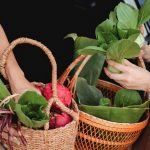 winter asian vegetables and leafy greens in baskets